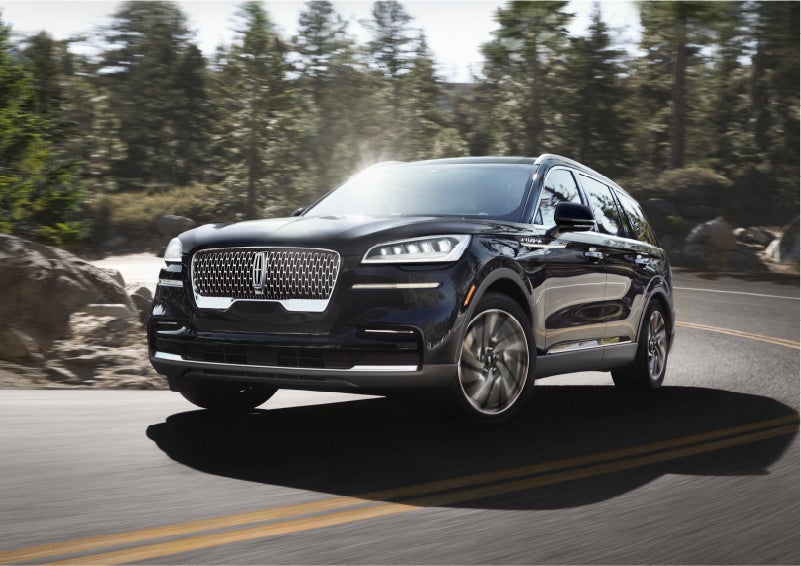A Lincoln Aviator® SUV is being driven on a winding mountain road | Kirk Brothers Lincoln of Vicksburg in Vicksburg MS