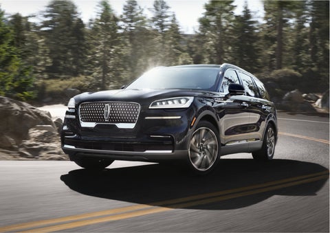 A Lincoln Aviator® SUV is being driven on a winding mountain road | Kirk Brothers Lincoln of Vicksburg in Vicksburg MS