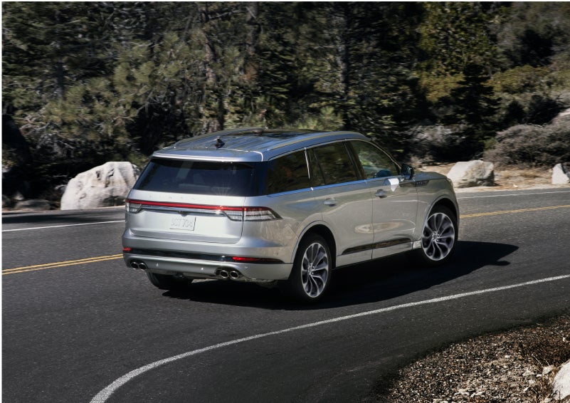 A Lincoln Aviator® is being driven on a winding road | Kirk Brothers Lincoln of Vicksburg in Vicksburg MS