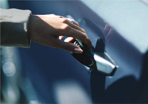 A hand gracefully grips the Light Touch Handle of a 2023 Lincoln Aviator® SUV to demonstrate its ease of use | Kirk Brothers Lincoln of Vicksburg in Vicksburg MS