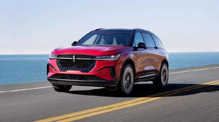 A 2025 Lincoln Nautilus® SUV is being driven on a seaside roadway. | Kirk Brothers Lincoln of Vicksburg in Vicksburg MS