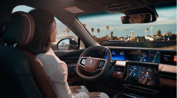 A person is shown driving hands-free on the highway with available Lincoln BlueCruise technology. | Kirk Brothers Lincoln of Vicksburg in Vicksburg MS