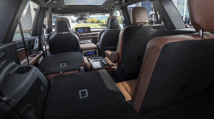 One side of the PowerFold® third-row seat and a second-row seat are folded forward in the 2026 Lincoln Aviator® SUV. | Kirk Brothers Lincoln of Vicksburg in Vicksburg MS