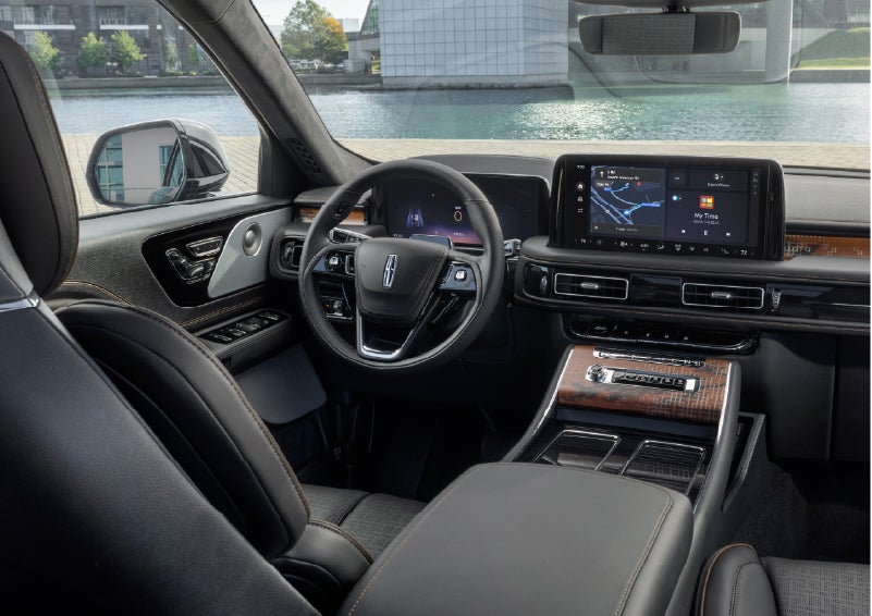 The interior of the 2026 Lincoln Aviator® SUV is shown parked with a view of a harbor through the windshield. | Kirk Brothers Lincoln of Vicksburg in Vicksburg MS