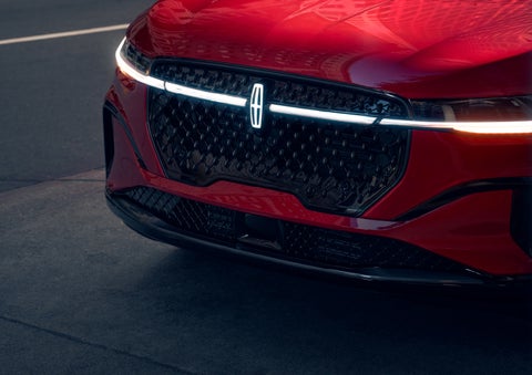 The available front LED light bar and center Lincoln Star logo glow at dusk. | Kirk Brothers Lincoln of Vicksburg in Vicksburg MS